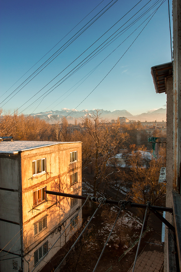 the view from my balcony, overlooking the typical neighbourhood in Bishkek with the majestic Tian Shan Mountains in the background