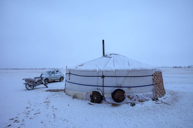 the brown blue Mongolian landscape turned white