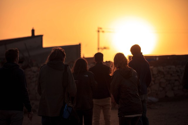 a group of tourists in the grassland