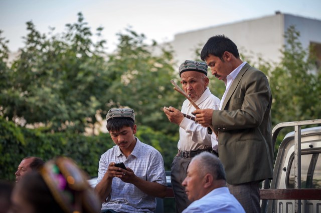 Uighur musicians playing their traditional music celebrating the wedding