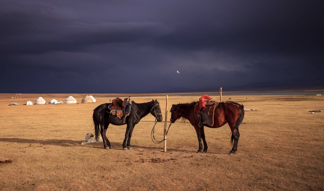 the sun was still shining while the dark clouds were still dominating the sky