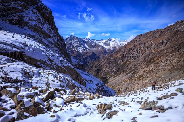 Amber climbing higher towards the lake, without proper equipments