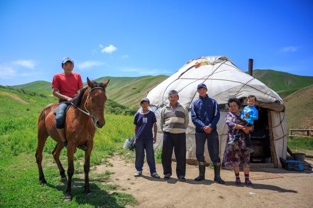 Khairat and a sherperd family posing in front of their bozui